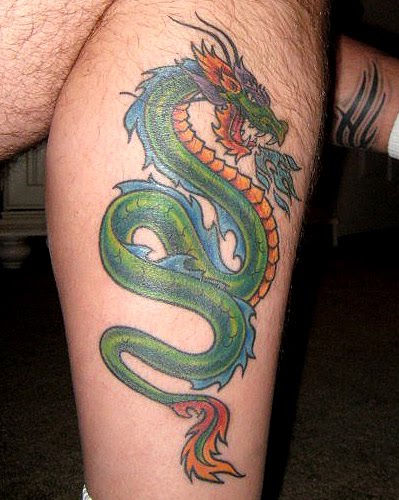 Green dragon leg tattoo