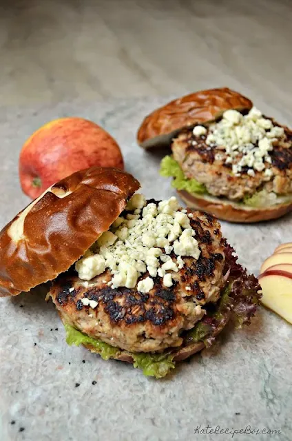 Finished apple and pork burgers on rolls.