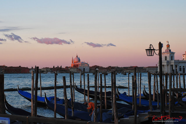 Gondolas and the dome of Il Redante catching first light, the Globe with Atlas and Fortune at Punta Dogana, Venice, Italy