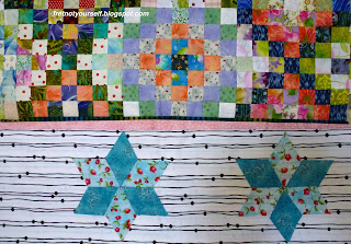 Auditioning six-pointed stars for a quilt border