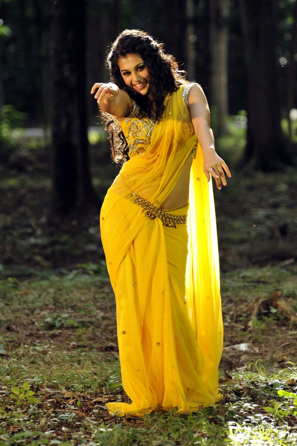 http://photoplusgold.blogspot.in/2013/02/tapsee-in-yellow-colur-saree-hot-and.html