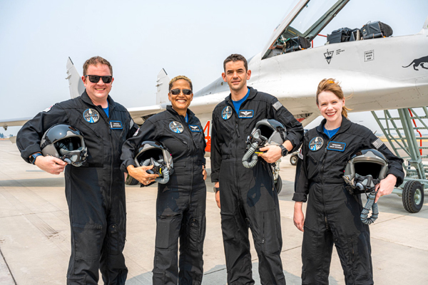 Inspiration4 astronauts Christopher Sembroski, Sian Proctor, Jared Isaacman and Hayley Arceneaux pose near a MiG-29 Fulcrum (that was piloted by Isaacman) after their formation flight in Montana...on August 8, 2021.