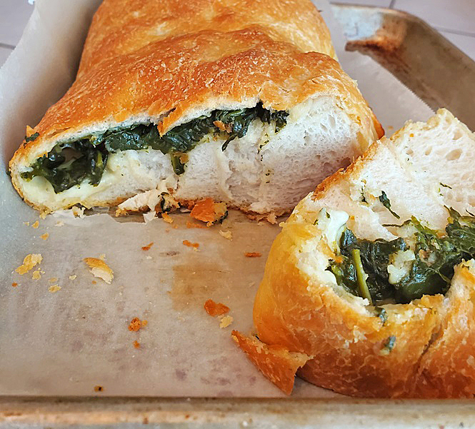 pizza dough stuffed with sauteed spinach