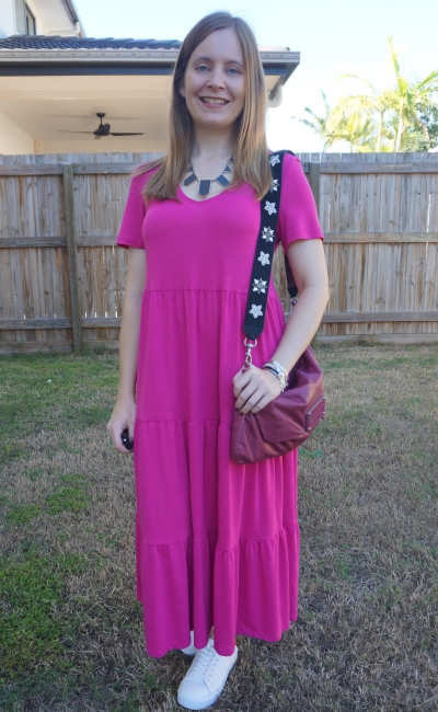 Kmart short sleeve tiered jersey dress in Fuchsia with marc by marc jacobs convertible clutch worn crossbody and sneakers | away from blue