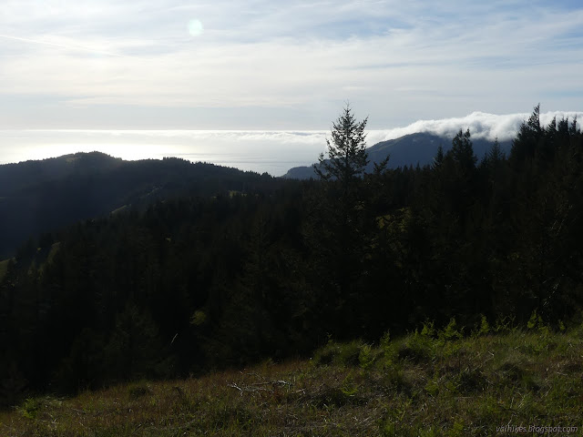 251: clouds topping a ridge