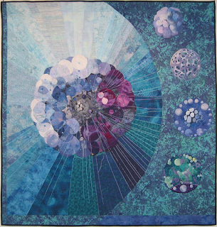 image: quilt by Barbara J. West, "Mandalas of Science I: Thalassicolla pelagica"