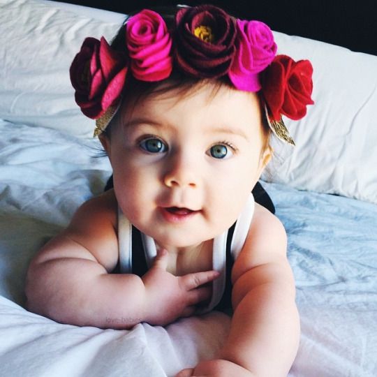 Cute Baby Girl with Rose Flowers