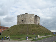 This is a classic example of a Motte and Bailey castle. (dsc )