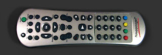 [Image: A television remote control with a couple dozen buttons and the label 'Hauppauge!'.]