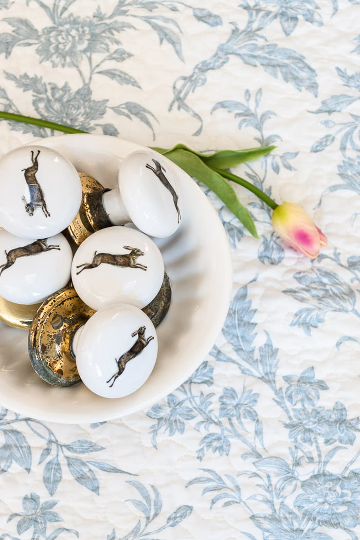 bowl of vintage ceramic door knobs with rabbit designs