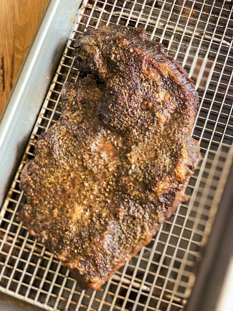 Oven Smoked Brisket is tender meat that tastes like it has been smoked in a smoker for hours.  You don't need a smoker to enjoy this mouthwatering oven smoked brisket.