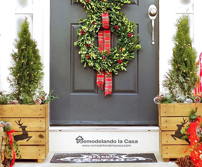 DIY wooden planters flanking the door