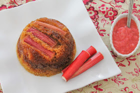 Food Lust People Love: This fresh rhubarb steamed sponge pudding is a light springtime recipe, highlighting the gorgeous pink tart rhubarb that is available now. This sticky dessert takes a while to cook but it's mostly hands off time. Wait to you bite into its soft sponge with tart topping! Totally worth the effort. The glossy pink rhubarb on top of this steamed pudding is a welcome bit of color on a dreary cold day.