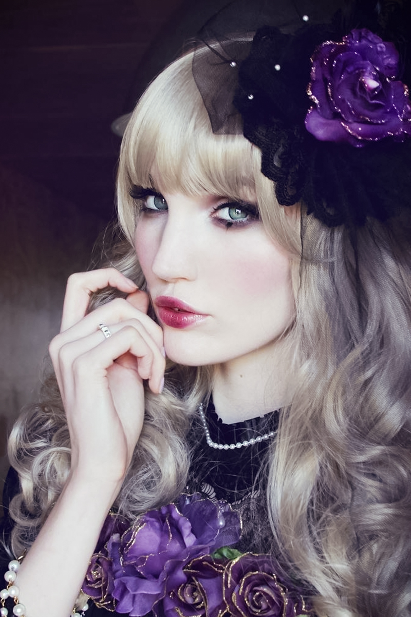 young woman in curly wig and Blushed Gothic Lolita Makeup Look with Kissable Lips