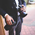 TEST 1 Business Man In A Suit Holding A Professional Camera