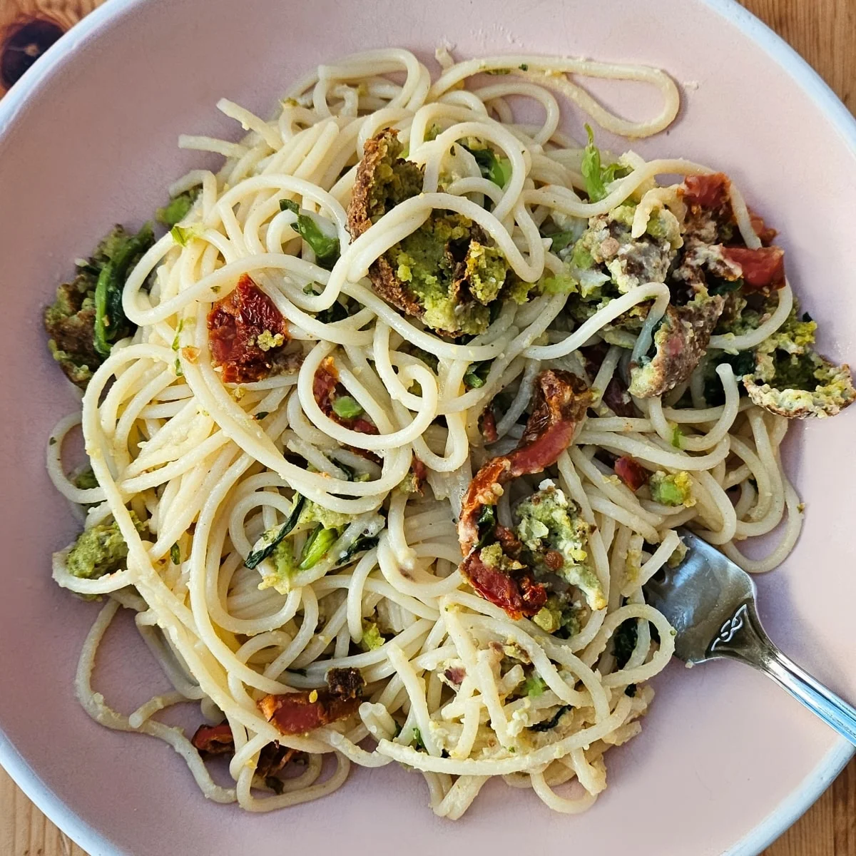 close up of hummus pasta in a pasta bowl.