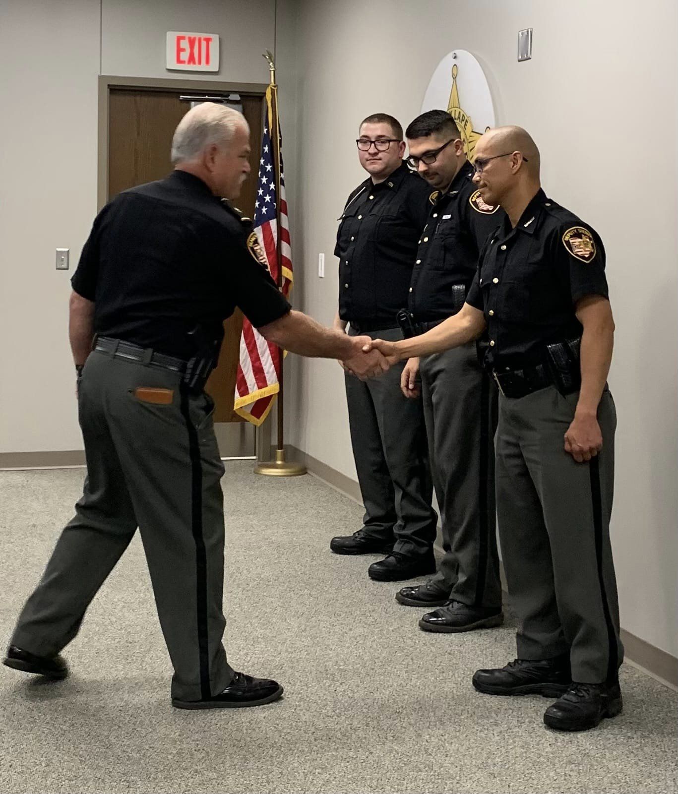 Sheriff Lape shaking hands with new members