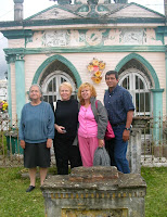 Doña Tere, me, Margarita, and Joaquin in front of an elaborate house for the dead in the Naolinco cemetery