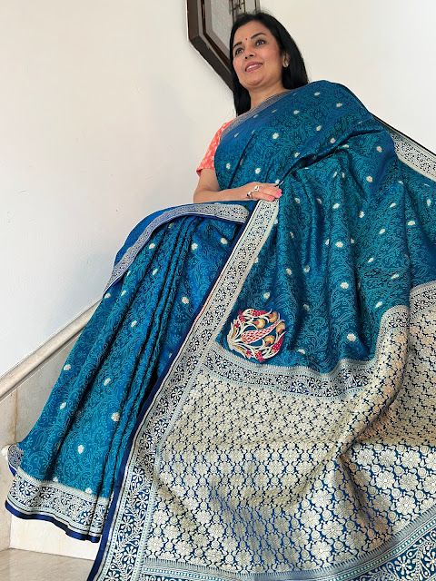 Turquoise blue silk tanchoi saree with a koniya