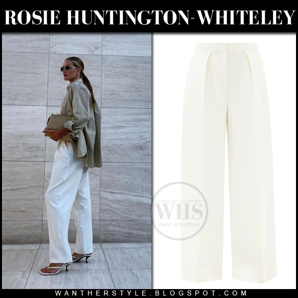 Rosie Huntington-Whiteley in white trousers and beige shirt