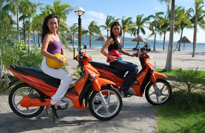 Kahna Verzosa and Irene French on 1000 watt electric motorbikes in Subic Freeport.