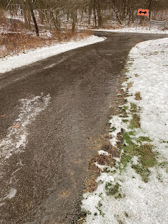 icy blacktop dip on trail