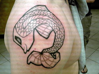 photo design grey celtic japanese koi fish tattoo on a man's shoulder