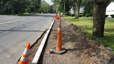 work underway on Chestnut St to add a sidewalk