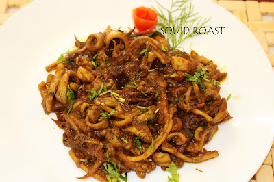 roasted calamari or kanava roast with yummy flavor of the spices a delightful lunch with this seafood meal is memorable