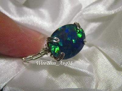 wire wrapped prong ring in sterling silver wire and opal