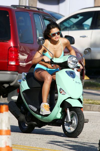 Vanessa Hudgens and Selena Gomez Riding Scooters - 13