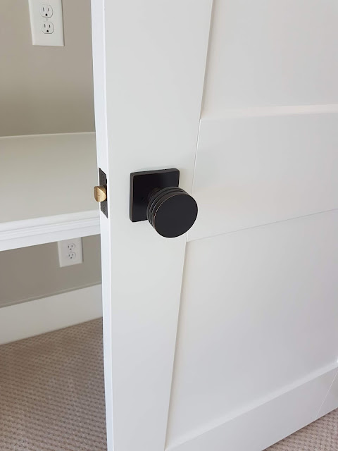 black hardware on wooden door