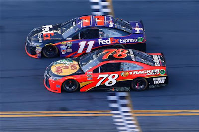 Denny Hamlin takes the checkered flag ahead of Martin Truex Jr. to win the #NASCAR Sprint Cup Series DAYTONA 500. 