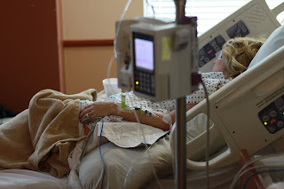 Hospital bed with patient