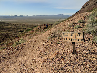 A sign for the mountain bike trail called "The Shit".