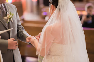 Couple exchanging rings