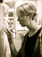 Artist Lisa Larrabee painting in her studio