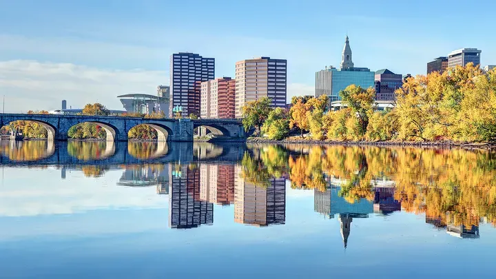 Fall foliage along the Connecticut River in Hartford. Hartford is the capital of the U.S. state of Connecticut. Hartford is known for its attractive architectural styles and being the Insurance capital of the United States (iStock / iStock)