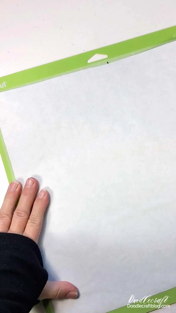 Place the shiny side of the freezer paper down on the Cricut cutting mat.