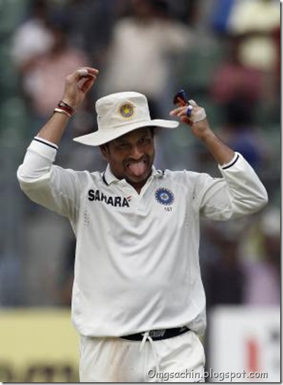 India's Sachin Tendulkar adjusts his cap as he walks back to the pavilion after the fourth day of their third and final test cricket match against West Indies