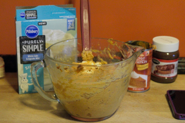 The cake mix, pumpkin puree, pumpkin pie spice, all combined in the mixing bowl