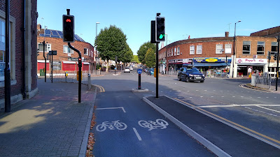 The cycle track meets a signalised junction with cycle traffic lights.