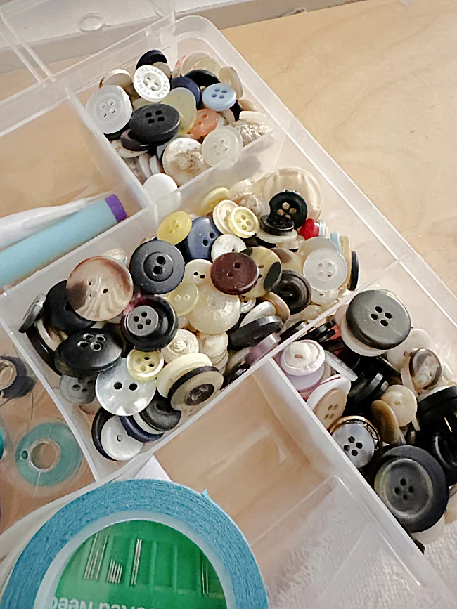 vintage buttons in a sewing box