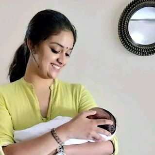 Keerthy Suresh in Green Dress with Cute Smile with a Cute Baby