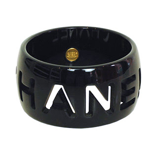 Vintage 1990's black resin Chanel bangle bracelet with cut-out logo.