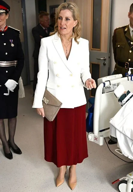 The Duchess of Edinburgh wore a chic white Indiana blazer by Altuzarra and a burgundy midi skirt by Aross Girl x Soler