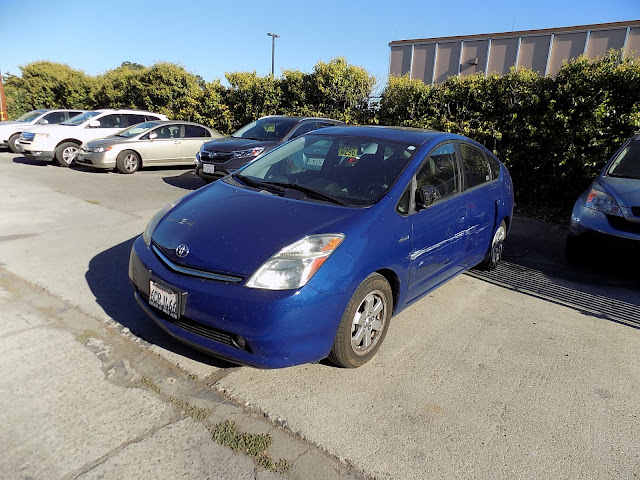 Collision damage on Prius at Almost Everything Auto Body before repairs.