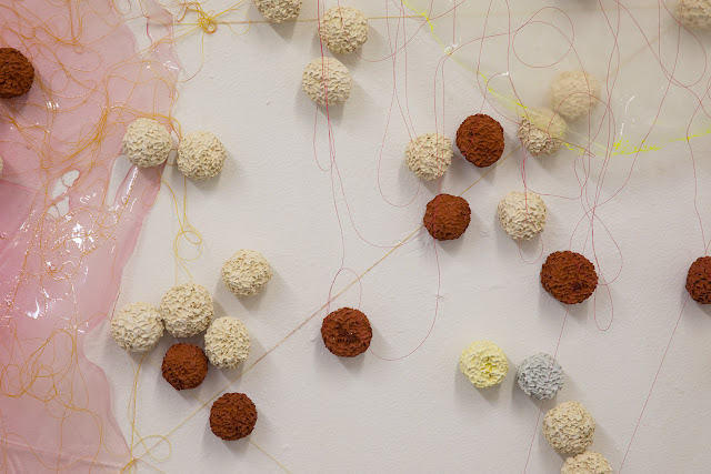 "Riso Amaro" VSC install: Approximately 47 x 59 inches. Acrylic paint skins, thread, terra cotta, porcelain, stoneware rice balls. 2019