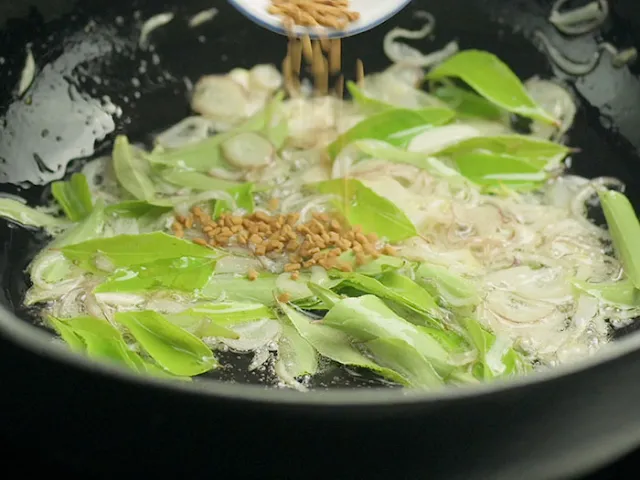 Add fenugreek seeds to the hot pot.