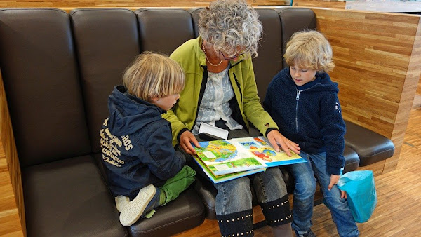 Image: Grandmother reading a book to her grandchildren, by Aline Dassel on Pixabay